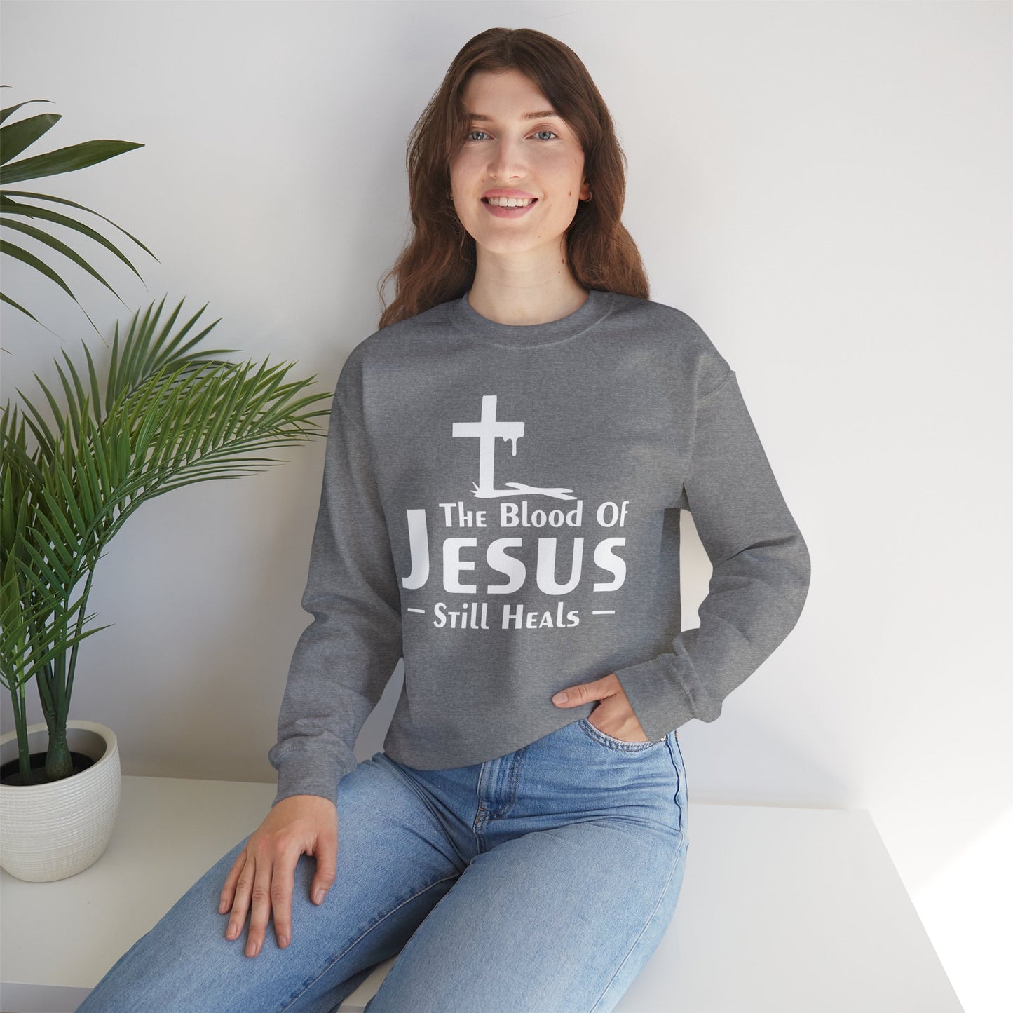 His Blood Still Heals Unisex Heavy Blend™ Crewneck Christian Sweatshirt