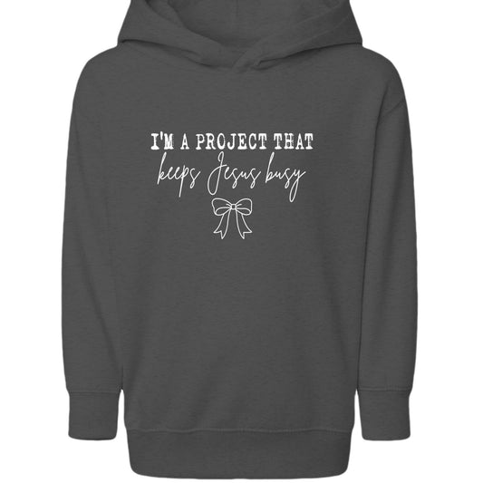 I’m A Project That Keeps Him Busy Toddler Christian Pullover Hooded Sweatshirt - ClaimedbyGodDesigns