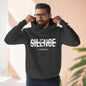 Man wearing a black hoodie with 'SILENCE is not my calling 2 Timothy 4:2' text.