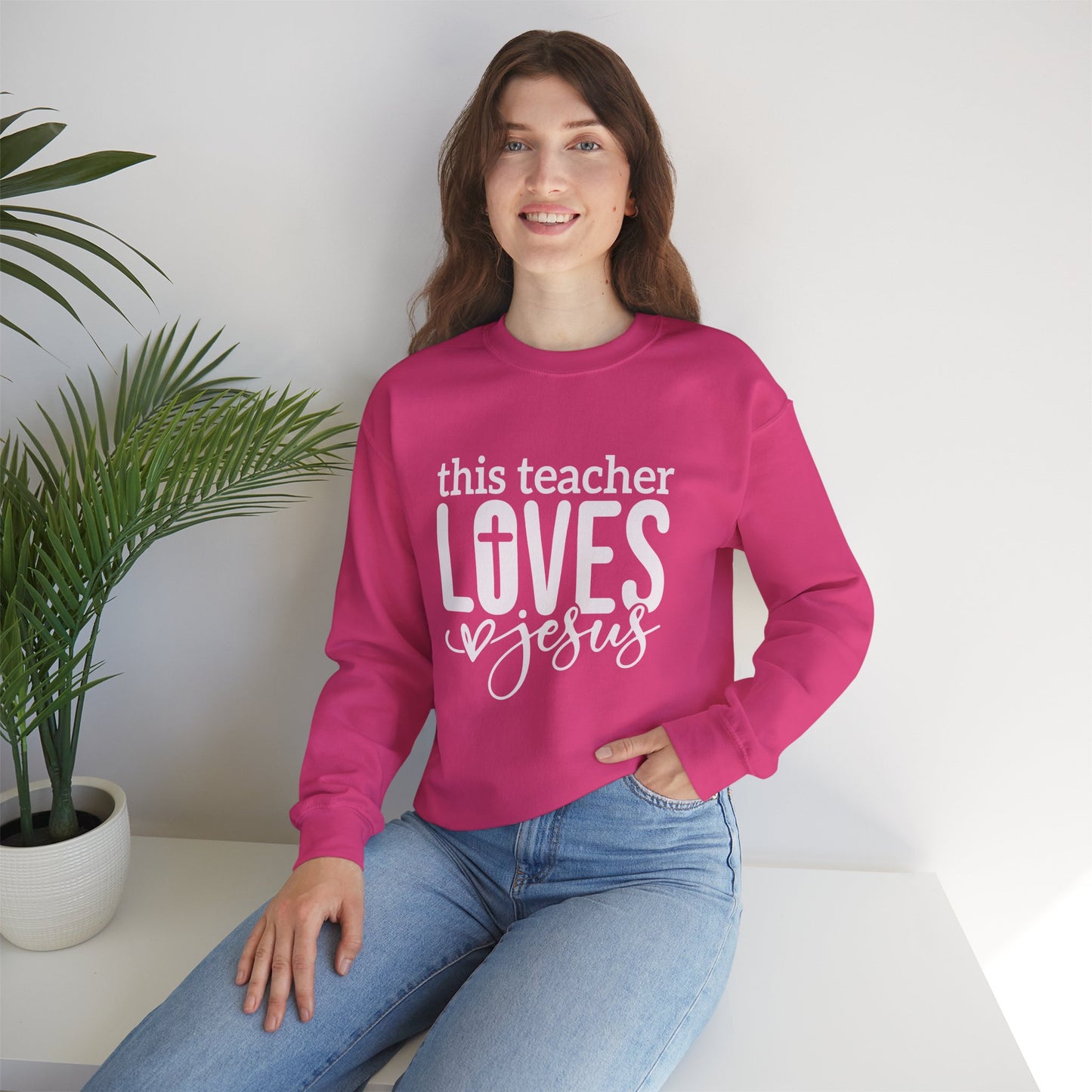 This Teacher Loves Jesus Unisex Heavy Blend™ Crewneck Christian Sweatshirt