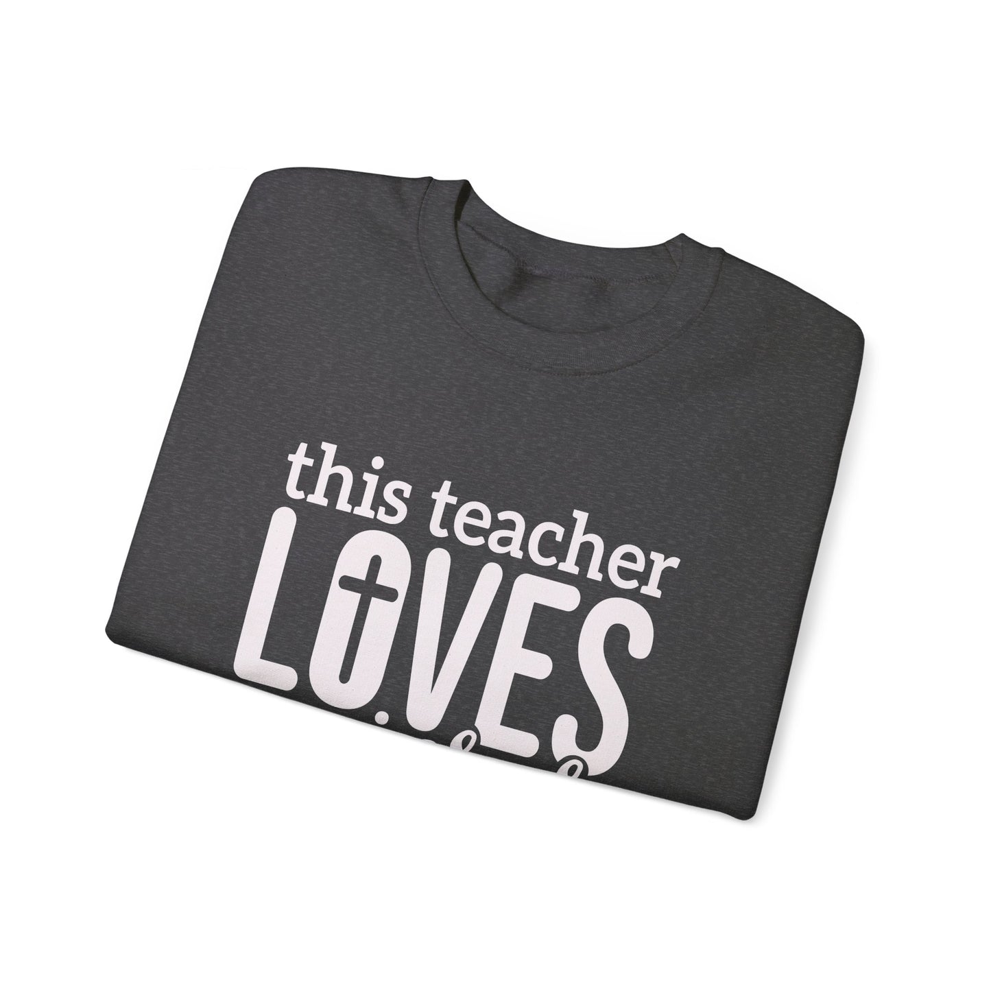 This Teacher Loves Jesus Unisex Heavy Blend™ Crewneck Christian Sweatshirt