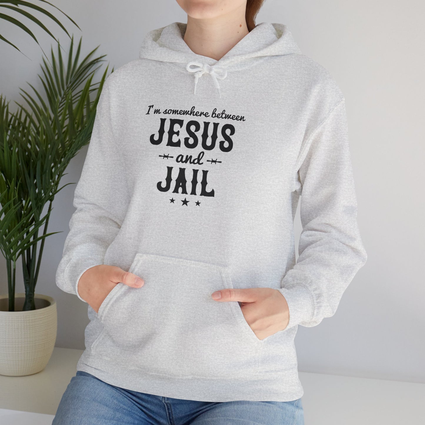 I'm Somewhere Between Jesus And Jail Funny Unisex Christian Hooded Pullover Sweatshirt