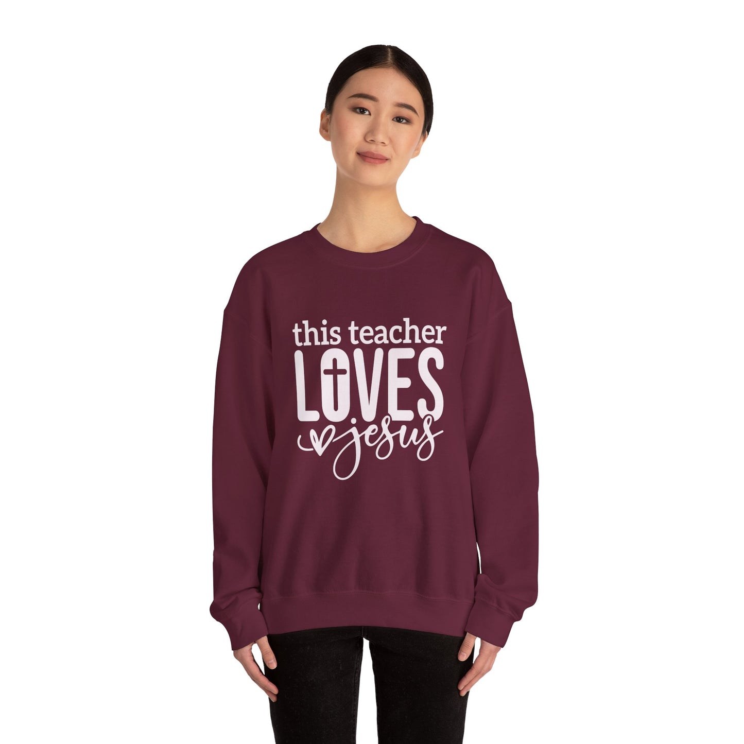 This Teacher Loves Jesus Unisex Heavy Blend™ Crewneck Christian Sweatshirt