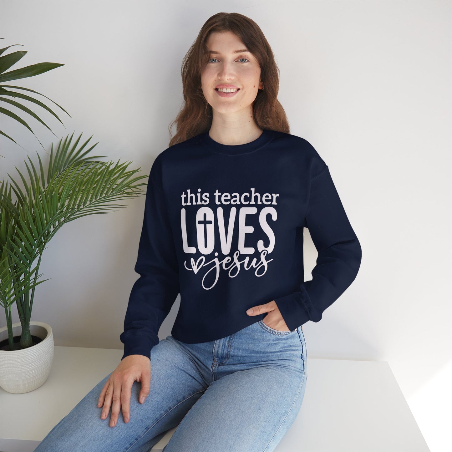 This Teacher Loves Jesus Unisex Heavy Blend™ Crewneck Christian Sweatshirt