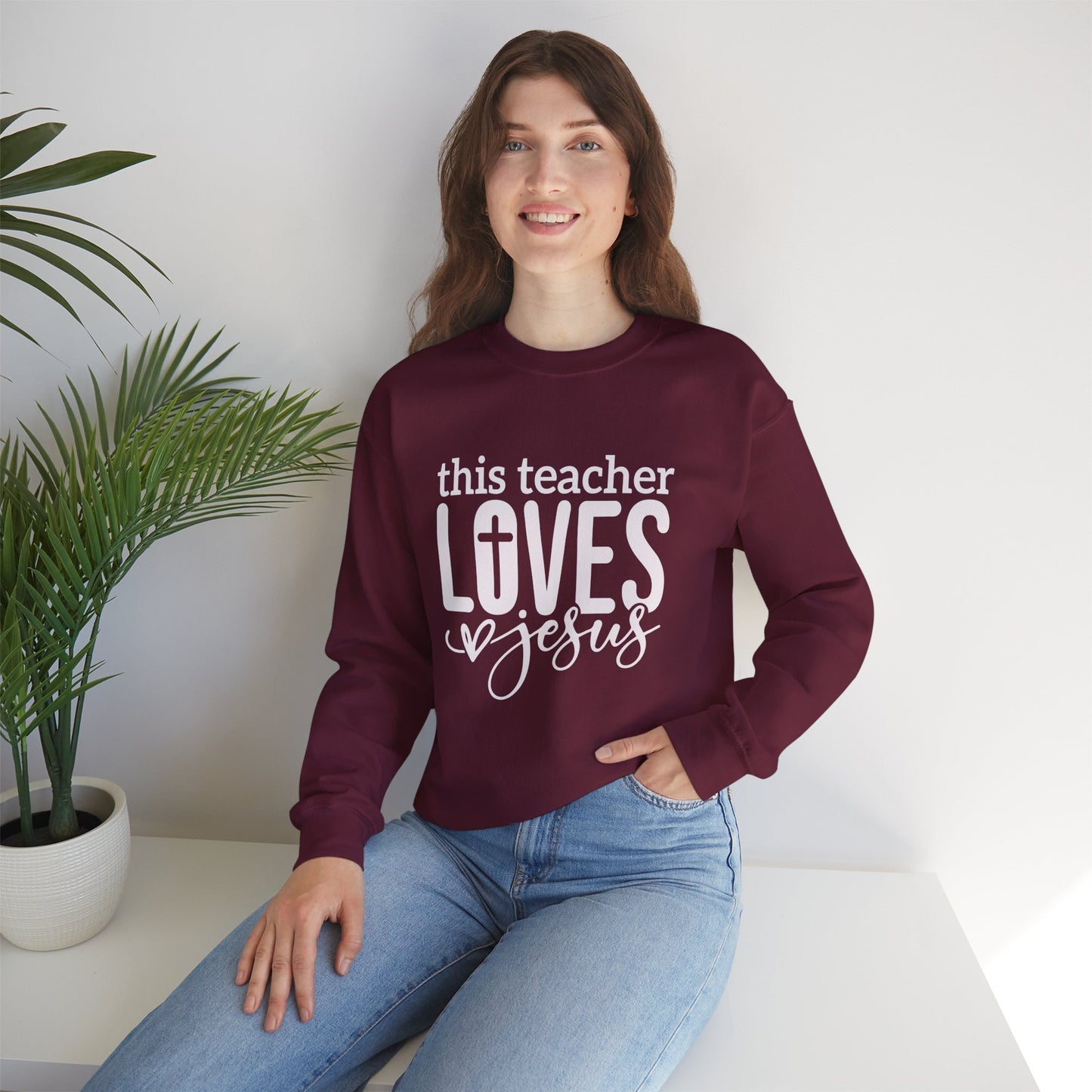 This Teacher Loves Jesus Unisex Heavy Blend™ Crewneck Christian Sweatshirt