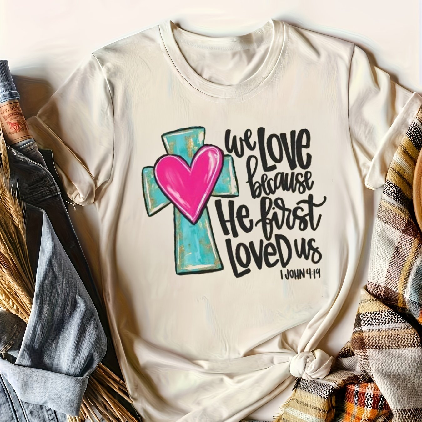 We Love Because He First Loved Us Women's Christian T-shirt claimedbygoddesigns