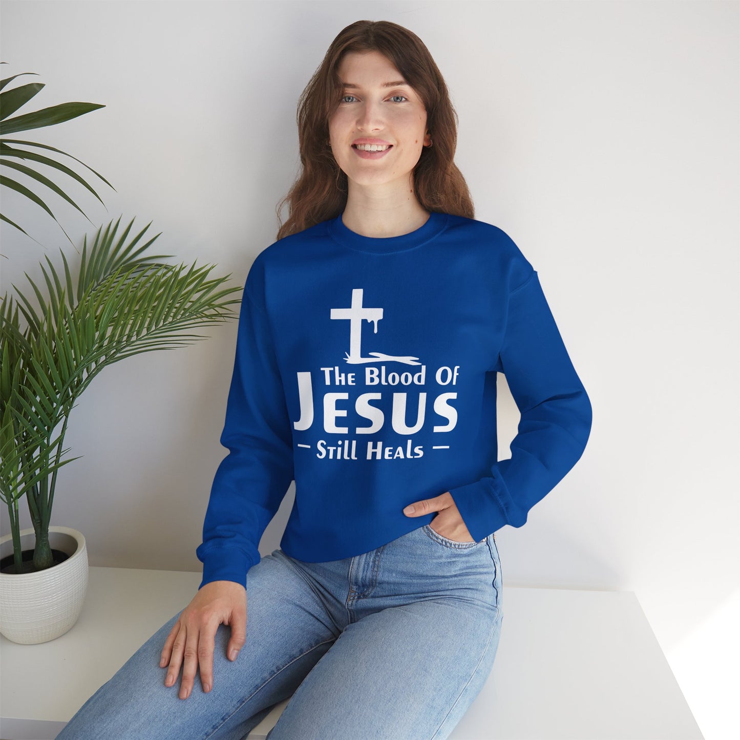 The Blood Of Jesus Still Heals Unisex Heavy Blend™ Crewneck Christian Sweatshirt