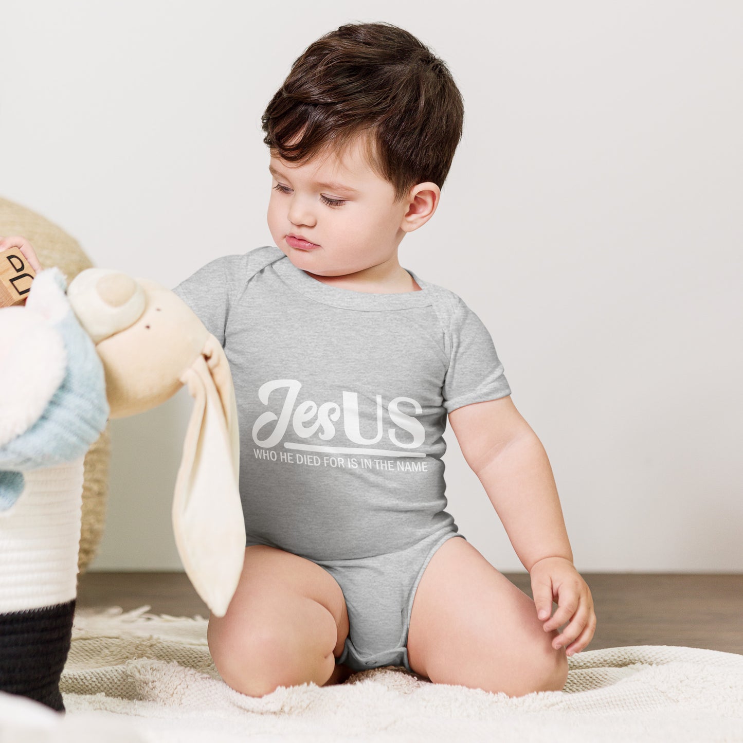 JesUS Who He Died For Is In The Name Christian Baby short sleeve onesie