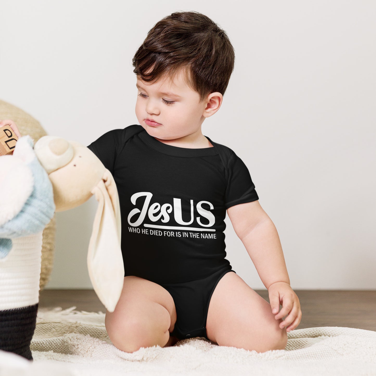 JesUS Who He Died For Is In The Name Christian Baby short sleeve onesie