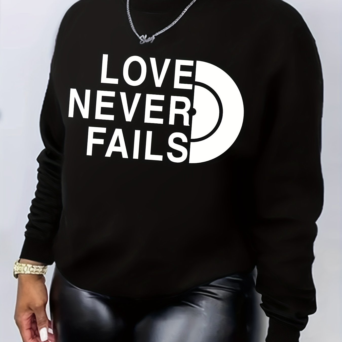 Love Never Fails Women's Christian Pullover Sweatshirt claimedbygoddesigns