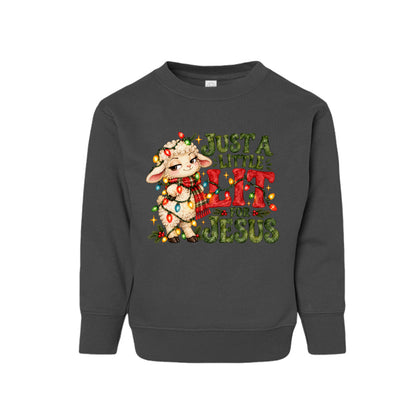 Just A Little Lit For Jesus toddler Christmas sweatshirt with a lamb wrapped in Christmas lights, front