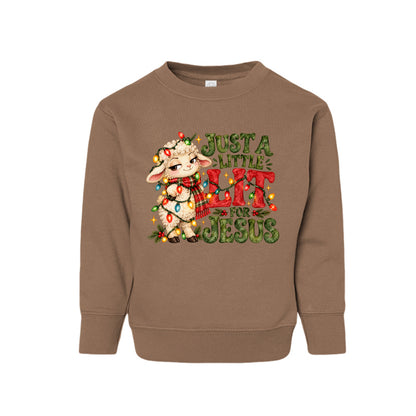 Just A Little Lit For Jesus toddler Christmas sweatshirt with a lamb wrapped in Christmas lights, front
