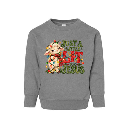 Just A Little Lit For Jesus toddler Christmas sweatshirt with a lamb wrapped in Christmas lights, front