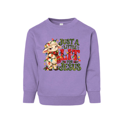 Just A Little Lit For Jesus toddler Christmas sweatshirt with a lamb wrapped in Christmas lights, front